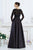 Janique 7516B Lace Embellished Long Sleeve Bateau Neck Long A-line Gown in Black